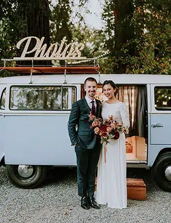 A bride and groom posed outside the Bay Area Fotowagen