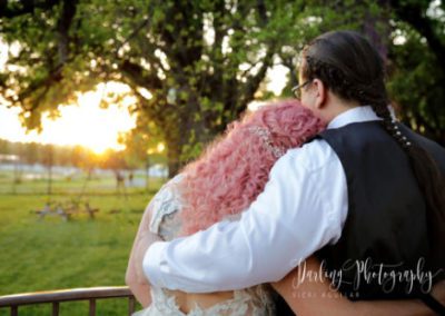 Bride and groom peacefully gazing at the sunset