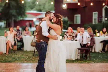 Photo of a bride and groom enjoying their first dance by Athena Kalindi Photography
