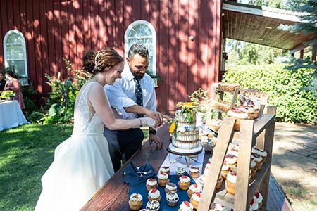 Penn Valley bride and groom cut wedding cake together