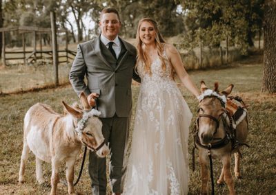 bride and groom with burros from drunken burro trailer
