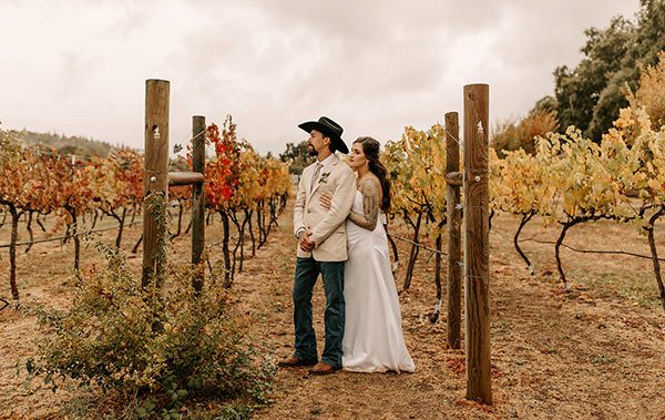 Groom and bride share a quiet moment together in our vineyard. Photo by Lela Spiva Photography