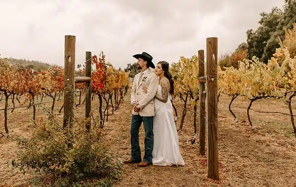 Groom and bride share a quiet moment together in our vineyard. Photo by Lela Spiva Photography