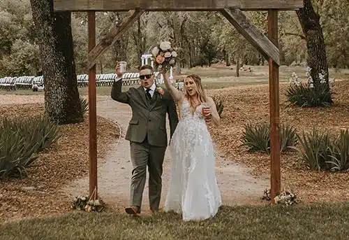 Newly married couple make a grand entrance into their reception. Photo by Ashton Imagery