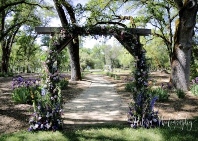 wooden arch covered in flowers