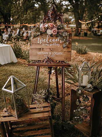 Wedding sign, crates, and floral in the boho wedding theme. Photo by Ashton Imagery