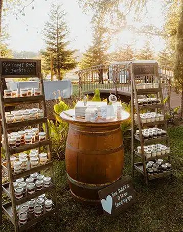 Wine barrel and shelves for wedding desserts. Photo by Wild Love + Wanderlust Photography