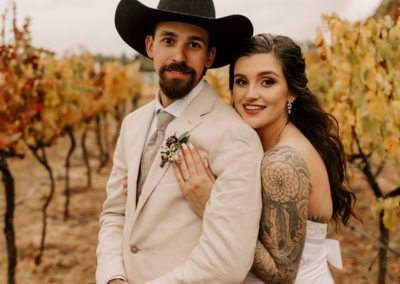 Bride and Groom in the Vineyard in the Fall