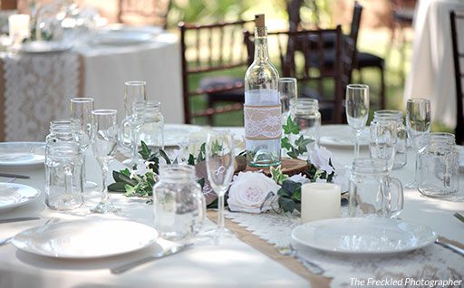 Simple, rustic place settings at an outdoor wedding