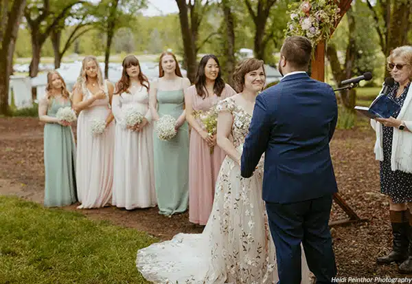 Bride and groom at their springtime wedding ceremony. Photo by Heidi Peinthor Photography