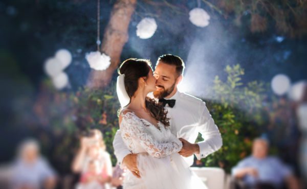 Bride and groom share a magical moment on the dance floor at their wedding reception