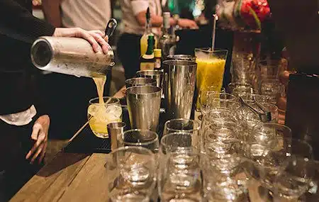 Bartender Serving a Brazilian caipirinha at a wedding reception