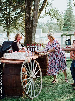 Bartender serving signature cocktails at a Rough & Ready Vineyards wedding. Photo by Athena Kalindi Photography.