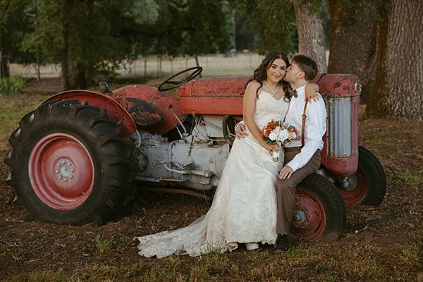Bride and groom on tractor
