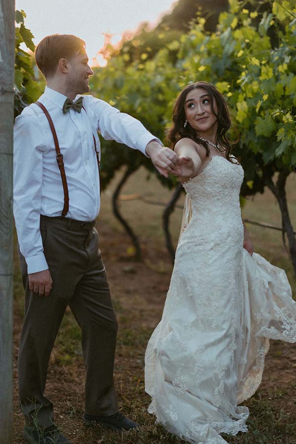 Couple posing in Rough and Ready Vineyard 