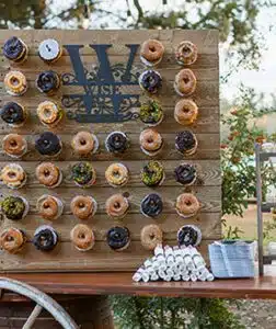 A doughnut wall ready for hungry wedding guests. Photo by Elizabeth Jane Photography