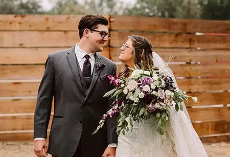 Lucas and Shawna smiling at each other. Photo by Mindful Media Photography