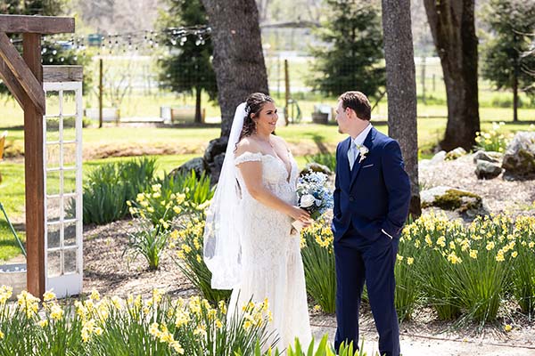 A bride and groom share a special moment in spring. Photo by Andrew and Melanie Photography