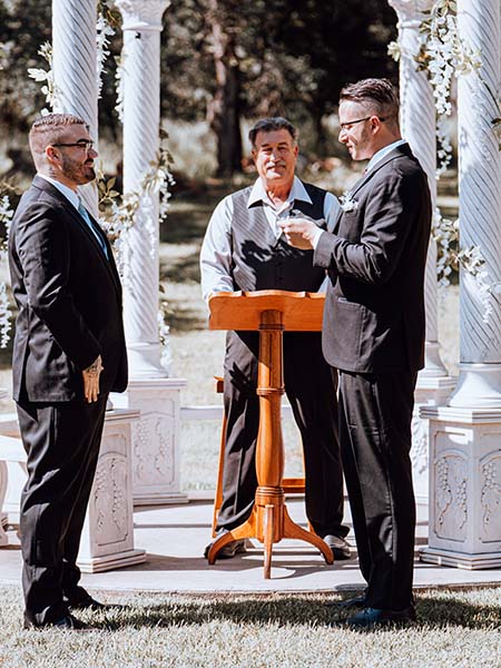 Two grooms exchange vows on a sunny day in May. Photo by Matt Vega/Hydef Videography 