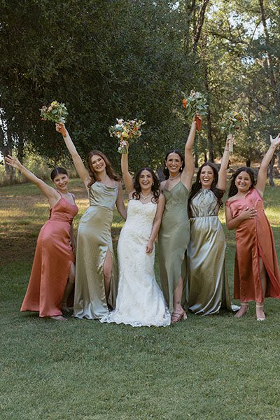 Bride and her bridesmaids having fun. Photo by Heidi Peinthor Photography