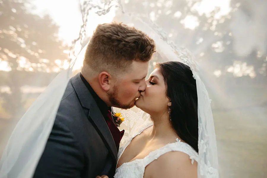 Kissing under the wooden arch