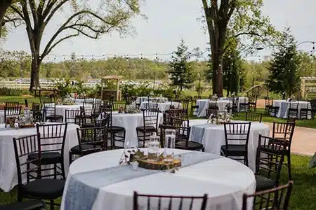 tables and chairs at outdoor wedding venue