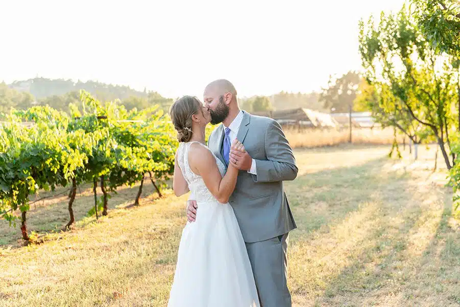 RebeccaTyler_9492-Enhanced-NR featured wedding couple Rebecca & Tyler vineyard view