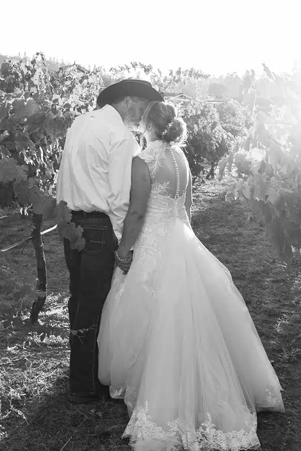 RondaMichaelSunsetVineyard Bride and groom at sunset at Rough and Ready Vineyards August wedding