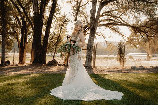 Maddy posing for a wedding portrait. Photo by Dream Capture Studios