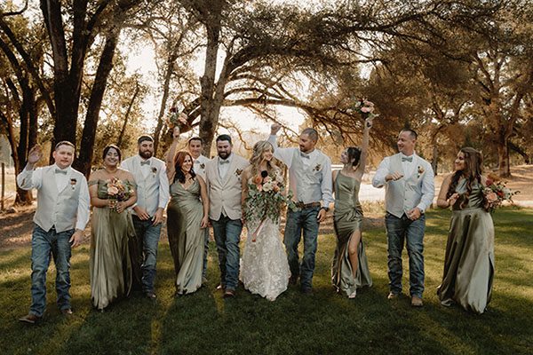 Maddy and Kasey having fun with their wedding party. Photo by Dream Capture Studios