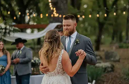 A bride and groom dancing at their spring wedding reception. Photo by Taylor Benedickt Photography
