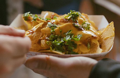 Close up of nachos at a wedding. Photo by Heidi Peinthor Photography