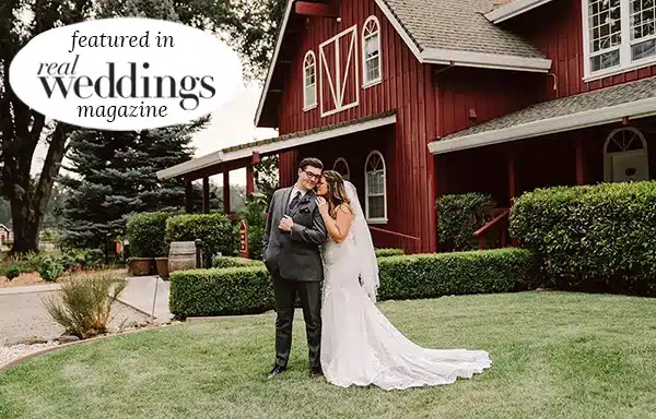 BrideGroomGuesthouse_FeaturedPage Featured Bride and groom in front of guesthouse lodging