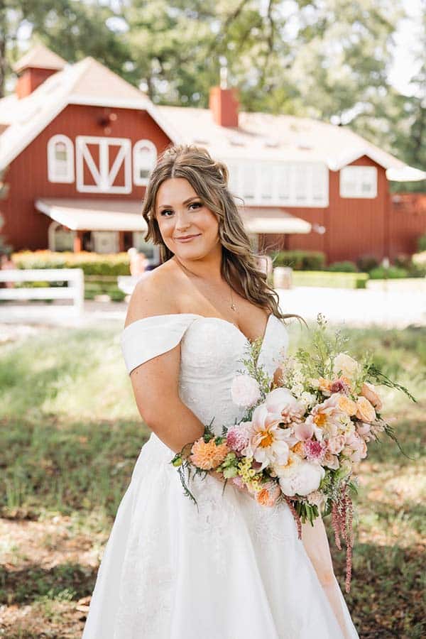 B24A8531 bride posing in front of guesthouse