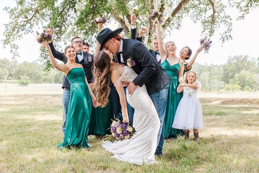 Kelle Pickell Photography -0068_(2048) bridal party behind couple in front pasture
