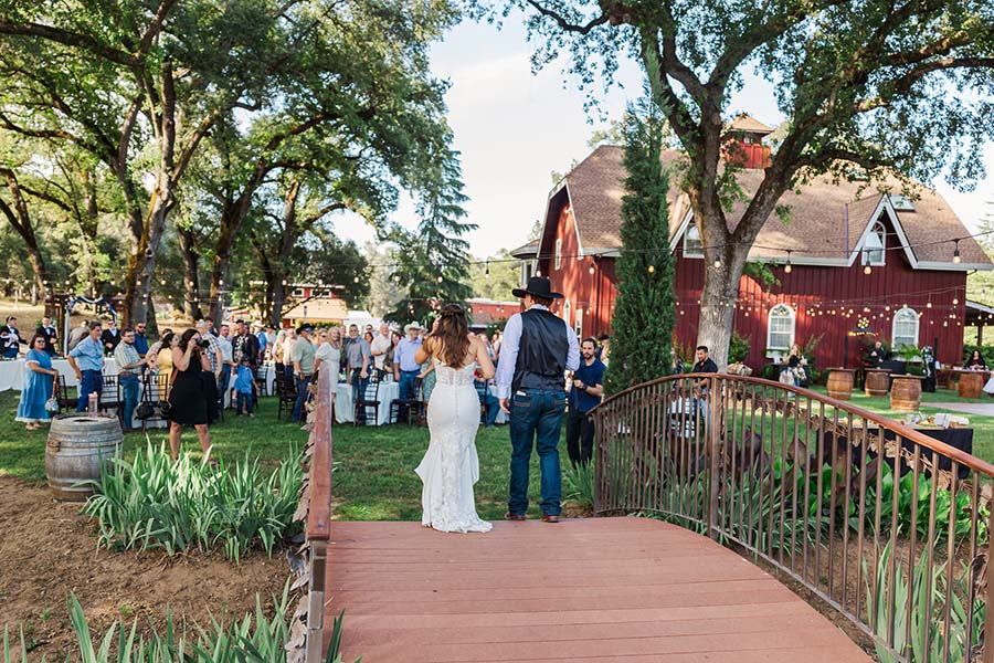 Kelle Pickell Photography -1023_(2048) Couple walking across bridge to reception