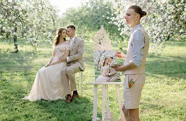 Artist painting a bride and groom al fresco