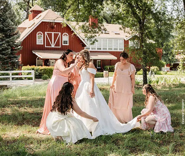 bride-check Bridesmaids and the maid of honor give the bride a final check before the ceremony. Photo by Essence Imagery
