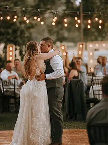 A bride and groom share their first dance at a Rough & Ready Vineyards wedding. Photo by Ashton Imagery